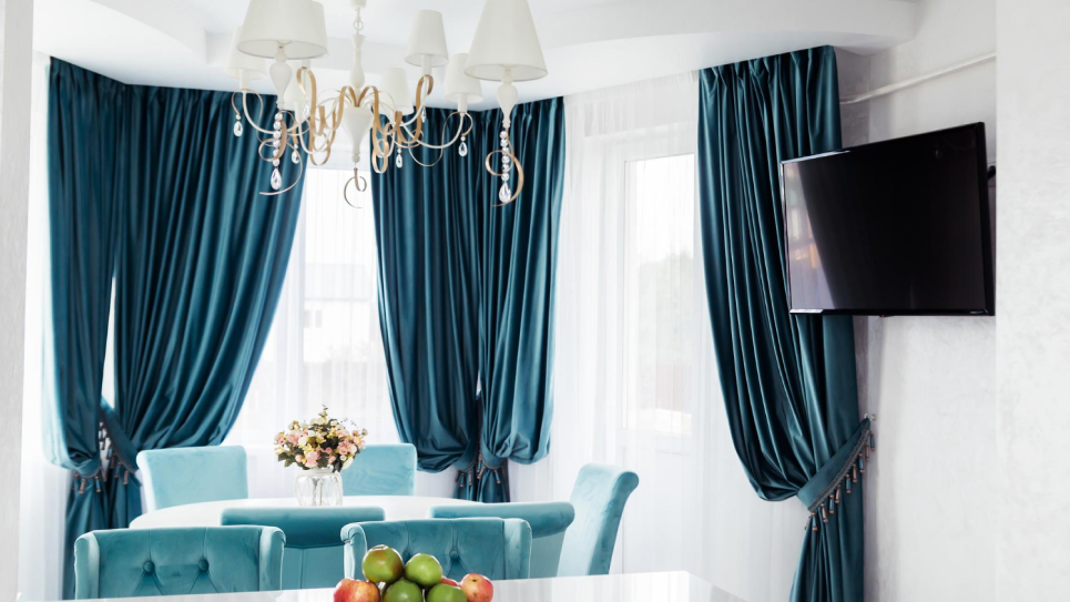 Elegant window with beautifully draped curtains in a modern interior